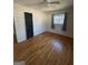 Bright bedroom features hardwood flooring, natural light, and neutral paint at 1988 Bencal Se Dr, Atlanta, GA 30316