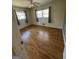 Bright bedroom features hardwood flooring, natural light, and neutral paint at 1988 Bencal Se Dr, Atlanta, GA 30316