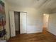 Bedroom featuring hardwood floors, a closet, and neutral walls, creating a blank canvas at 1988 Bencal Se Dr, Atlanta, GA 30316