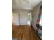 Bedroom featuring hardwood floors, a closet, and neutral walls, creating a blank canvas at 1988 Bencal Se Dr, Atlanta, GA 30316
