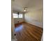 Bedroom features wood flooring and natural light from the window at 1988 Bencal Se Dr, Atlanta, GA 30316
