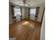 Bright bedroom features hardwood flooring, natural light, and colorful curtains at 1988 Bencal Se Dr, Atlanta, GA 30316