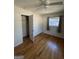 Bright bedroom features hardwood flooring, natural light, and a closet at 1988 Bencal Se Dr, Atlanta, GA 30316