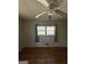 Bright bedroom features hardwood flooring, natural light, and a ceiling fan at 1988 Bencal Se Dr, Atlanta, GA 30316