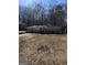 Charming ranch-style home featuring a well-kept lawn and mature trees at 1988 Bencal Se Dr, Atlanta, GA 30316