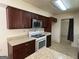 A kitchen with brown cabinets, white countertops, and stainless steel appliances at 1988 Bencal Se Dr, Atlanta, GA 30316