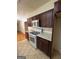 A kitchen with brown cabinets, white countertops, and stainless steel appliances at 1988 Bencal Se Dr, Atlanta, GA 30316