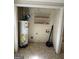 A laundry room with a water heater and shelves at 1988 Bencal Se Dr, Atlanta, GA 30316