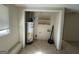 A laundry room with a water heater and shelves at 1988 Bencal Se Dr, Atlanta, GA 30316