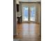 Open living area featuring wood flooring and natural light, with french doors leading to the backyard at 1988 Bencal Se Dr, Atlanta, GA 30316