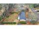Aerial view of home and backyard showcasing its perimeter and large wooded lot at 334 Nancy Sw Ct, Lilburn, GA 30047