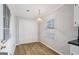 Bright dining area features hardwood floors, window, and lighting at 334 Nancy Sw Ct, Lilburn, GA 30047