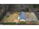 Aerial view of home and backyard showcasing its perimeter and large wooded lot at 334 Nancy Sw Ct, Lilburn, GA 30047