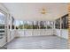 Enclosed patio with ceiling fan and many windows offering natural light and great view at 334 Nancy Sw Ct, Lilburn, GA 30047