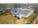 A charming single-story home has a back patio perfect for entertaining and a large backyard at 334 Nancy Sw Ct, Lilburn, GA 30047