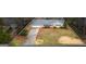 Charming single-story home with mature landscaping, an attached two car garage, and a long driveway at 334 Nancy Sw Ct, Lilburn, GA 30047