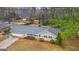 Charming single-story home with mature landscaping, an attached two car garage, and a long driveway at 334 Nancy Sw Ct, Lilburn, GA 30047