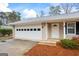 Close-up of attached garage and front entrance of house with white door at 334 Nancy Sw Ct, Lilburn, GA 30047
