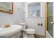 Bathroom features an ornate, vintage faucet and fixtures, with a ceramic sink and tile flooring at 334 Nancy Sw Ct, Lilburn, GA 30047