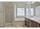 Bright bathroom featuring tiled shower, soaking tub, and modern vanity with lots of natural light at 208 Clifton Ln, Peachtree City, GA 30269