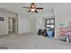 Bright bedroom featuring a ceiling fan, large closet doors and great natural light at 208 Clifton Ln, Peachtree City, GA 30269