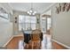 Cozy dining area with hardwood floors, natural light, and classic wooden furniture at 208 Clifton Ln, Peachtree City, GA 30269