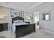 Primary bedroom boasting neutral walls, trey ceilings, dark wood furniture, and access to the primary bath at 208 Clifton Ln, Peachtree City, GA 30269