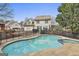 Sparkling backyard pool and jacuzzi surrounded by fence with ample space for relaxation and entertainment at 208 Clifton Ln, Peachtree City, GA 30269