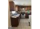 Kitchen with granite countertop, stainless steel appliances, and tile backsplash at 287 Henry Aaron Sw Ave, Atlanta, GA 30310