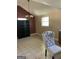 Living room with tile floors, chair and shelving at 287 Henry Aaron Sw Ave, Atlanta, GA 30310
