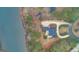 An aerial view of a home with a driveway and a scenic lake nearby at 256 Allie Dr, Mcdonough, GA 30252