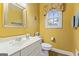 Powder room with single vanity and decorative mirror at 256 Allie Dr, Mcdonough, GA 30252