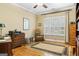 Cozy bedroom with hardwood floors, shutters, and decorative rug at 256 Allie Dr, Mcdonough, GA 30252