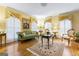 Inviting living room featuring hardwood floors, ornate decor, and ample natural light for a sophisticated ambiance at 256 Allie Dr, Mcdonough, GA 30252