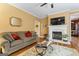 A spacious living room showcases hardwood floors and a fireplace at 256 Allie Dr, Mcdonough, GA 30252