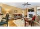 Inviting living room features a fireplace and ceiling fan at 256 Allie Dr, Mcdonough, GA 30252