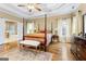 Well-lit main bedroom with hardwood floors and ensuite bathroom at 256 Allie Dr, Mcdonough, GA 30252