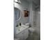 This bathroom includes a shower and bath combo, with a light blue wall color at 410 Mockingbird Dr, Loganville, GA 30052