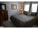 Comfortable bedroom with a decorative bedspread, matching pillows, and a vintage wooden dresser at 410 Mockingbird Dr, Loganville, GA 30052