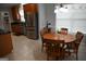 Cozy breakfast nook with round wood table and a window for natural light at 410 Mockingbird Dr, Loganville, GA 30052