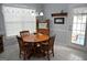 Cozy dining area featuring a round wood table and classic decor at 410 Mockingbird Dr, Loganville, GA 30052