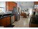 Open kitchen and breakfast nook with stainless steel appliances, and wood cabinets at 410 Mockingbird Dr, Loganville, GA 30052