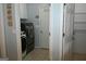 Organized laundry room with modern washer and dryer and walk-in storage at 410 Mockingbird Dr, Loganville, GA 30052