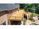 Aerial view of a deck area, beautiful pool and spa surrounded by lush greenery, creating a private oasis at 401 Robinson Rd, Peachtree City, GA 30269