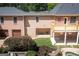 Backyard of this home features a covered patio underneath the deck with a well-maintained garden at 401 Robinson Rd, Peachtree City, GA 30269