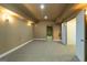 Finished basement area with neutral carpet and paint, and access to additional unfinished spaces at 401 Robinson Rd, Peachtree City, GA 30269
