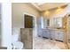 Bright bathroom featuring double vanity, tile floors, recessed lighting, and toilet in separate room at 401 Robinson Rd, Peachtree City, GA 30269