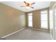 Bedroom with carpet, ceiling fan, and two windows at 401 Robinson Rd, Peachtree City, GA 30269
