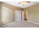 Bedroom with carpet, ceiling fan, and closet at 401 Robinson Rd, Peachtree City, GA 30269
