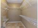 Walk-in closet features wire shelving and tile flooring at 401 Robinson Rd, Peachtree City, GA 30269